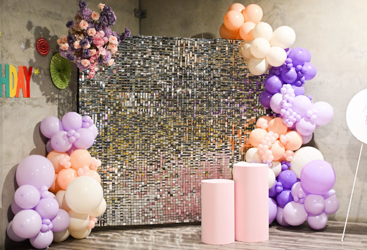 Lavender, peach, and cream balloon garland with shimmer backdrop