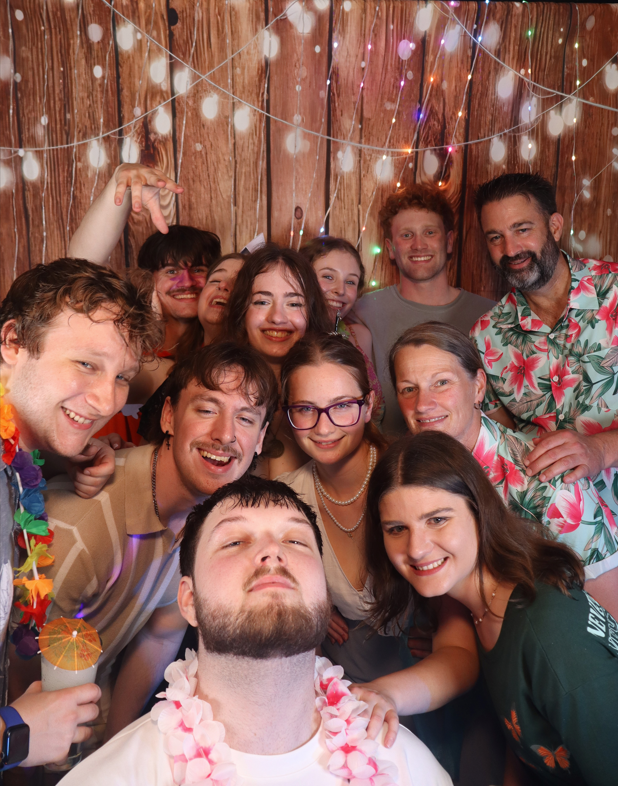 Mirror photobooth group portrait with party guests