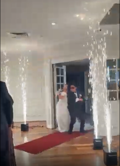 Sparkular cold spark fountains framing a wedding entrance